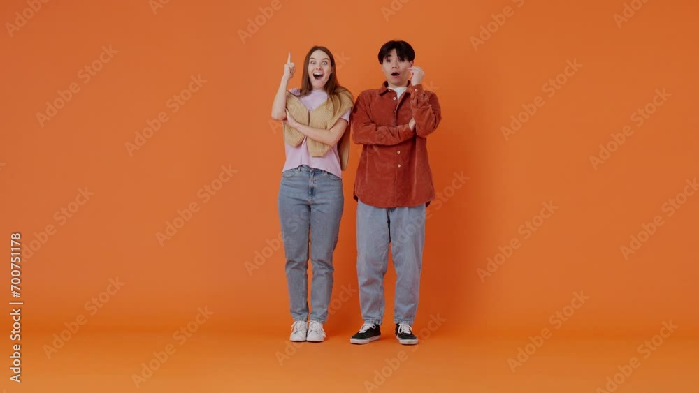 European woman and Asian man come up with idea in studio European woman and Asian man come up with idea in studio