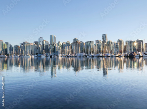 Skyline of Vancouver as seen from Stanley Park during a golden hour evening in the fall in British Columbia, Canada