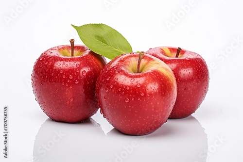 Ripe red apples displayed against a white background.