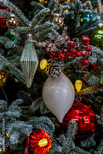 Close up of ornaments on a Christmas tree at a conservatory in Pennsylvania. Red and white decorations.