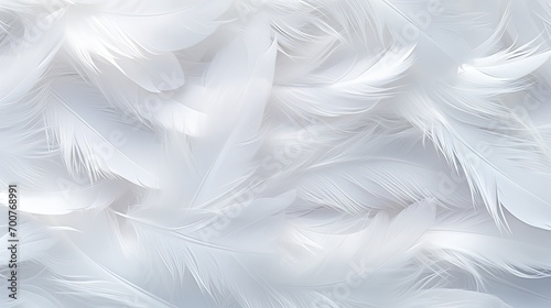 White fluffy airy gentle feathers on a light background © natalia