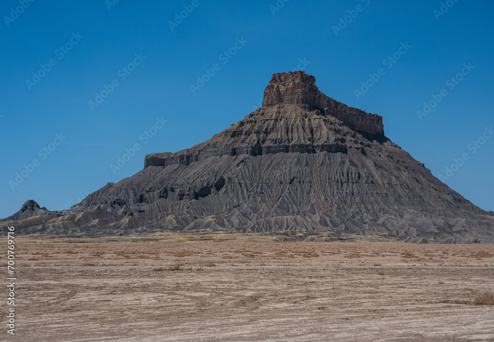 Factory Butte, A geological feature and hill in Utah, near the town of Hanksville. Blue sky, bright light