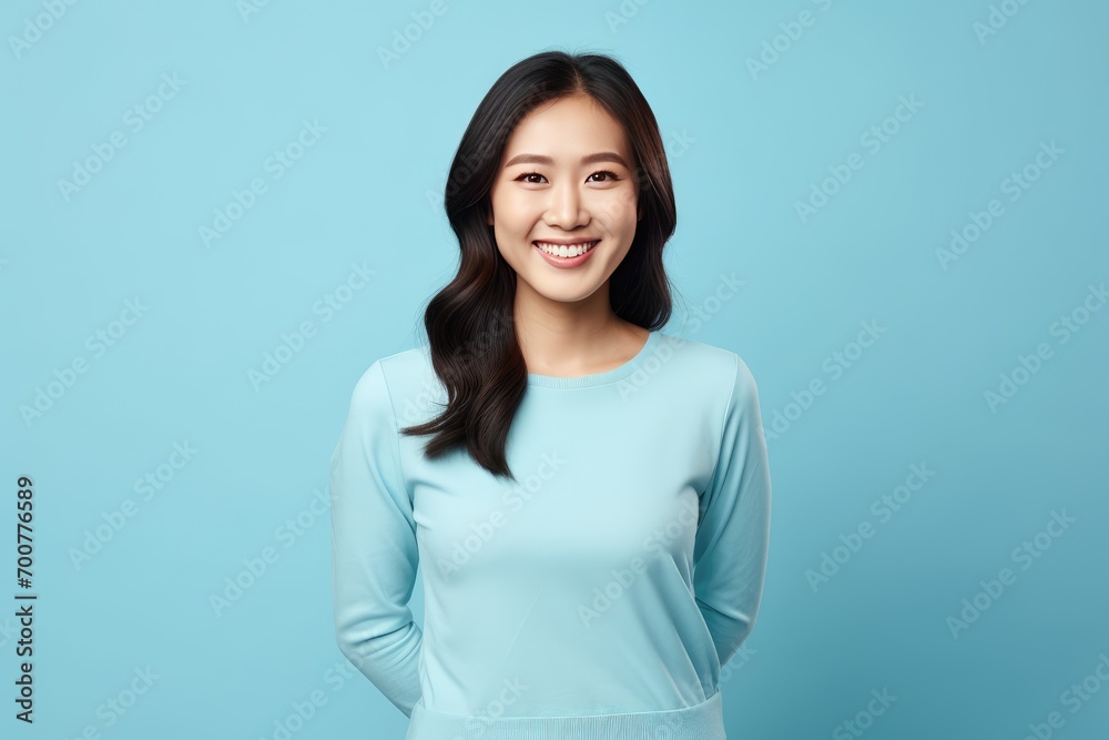 Cute woman with perfect smile on blue background Cute woman with perfect smile on blue background