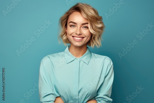 Cute woman with perfect smile on blue background