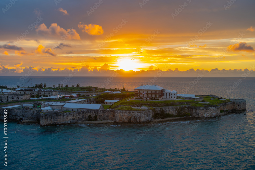 National Museum of Bermuda and rampart with sunset at the background in the former Royal Naval Dockyard in Sandy Parish, Bermuda. 