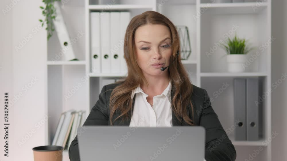 In workspace, a female consultant looks modern and elegant. Her high level of competence and friendship make her a key player in the world of customer support. Call center operator working from home In workspace, a female consultant looks modern and elegant. Her high level of competence and friendship make her a key player in the world of customer support. Call center operator working from home