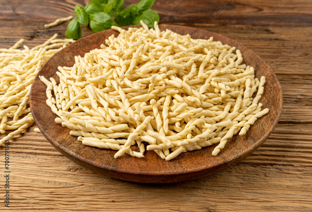 Raw Trofie Pasta, Dry Italian Macaroni, Traditional Genoa Food, Raw Noodle, Modern Ligurian Cuisine Raw Trofie Pasta, Dry Italian Macaroni, Traditional Genoa Food, Raw Noodle, Modern Ligurian Cuisine