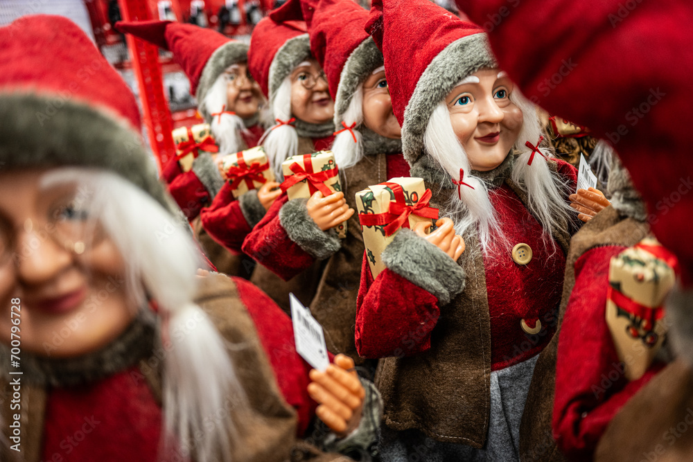 Female santa clause christmas decorations in a shop.