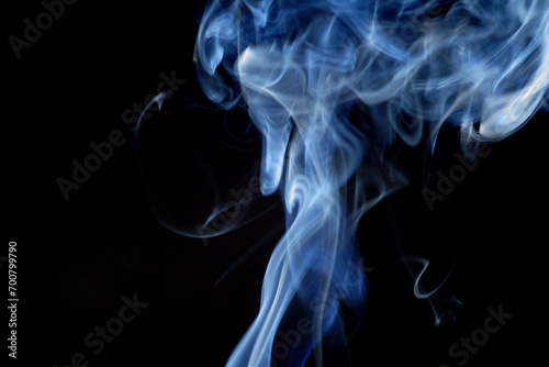 real blue cigarette smoke on a black background