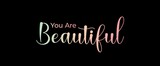 You are Beautiful handwritten slogan on dark background. Brush calligraphy banner. Illustration quote for banner, card or t-shirt print design. Message inspiration. Aesthetic design.
