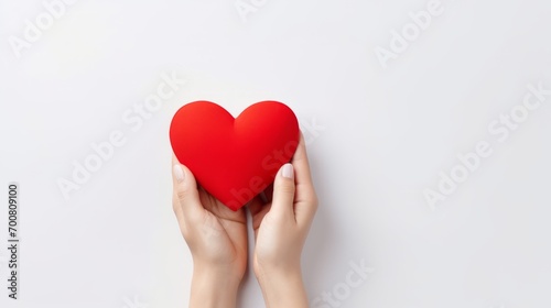 Love in the Palm  A Tender Gesture of Affection Captured in a Delicate Paper Heart on a Serene White Background