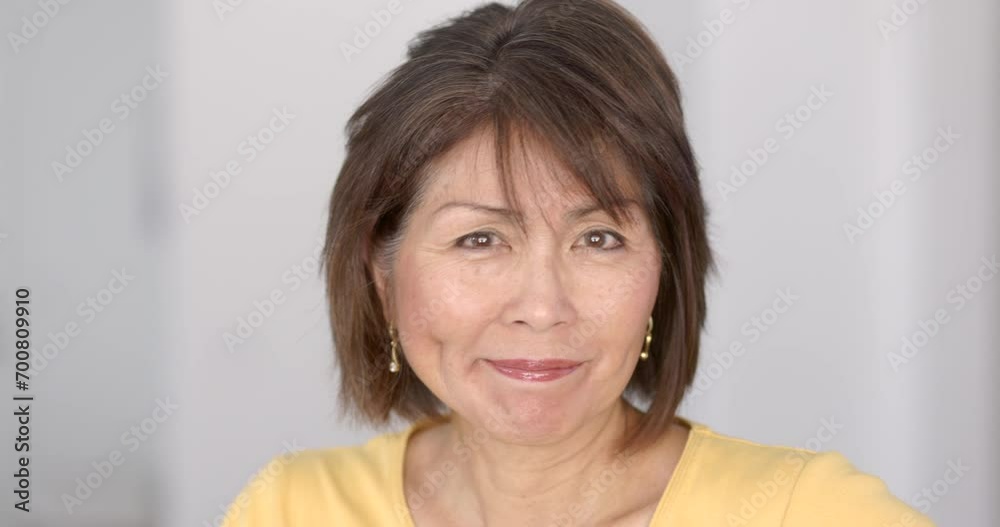 Closeup attractive woman smiling looking at camera enjoying making funny face gestures wink and smirk happy concept. Closeup attractive woman smiling looking at camera enjoying making funny face gestures wink and smirk happy concept.