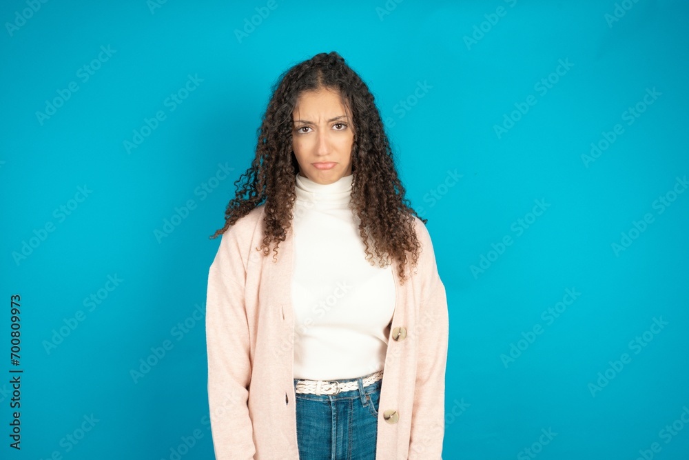 Displeased upset beautiful teen girl frowns face as going to cry, being discontent and unhappy as can't achieve goals, Disappointed model has troubles Displeased upset beautiful teen girl frowns face as going to cry, being discontent and unhappy as can't achieve goals, Disappointed model has troubles