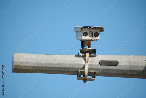 Traffic security camera that displays vehicle passes on the pole photo