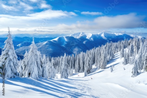Panorama of mountains with snowy off-piste slope and blue sunlit sky at winter. © Maksymiv Iurii