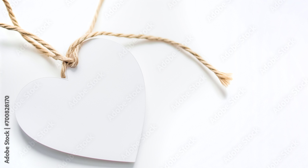 heart sign valentines day with rope knot isolated on white background. white heart tag - obrazy, fototapety, plakaty 