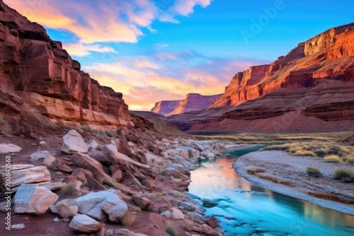 Breathtaking Canyon Sunset with Reflective River Flowing Through