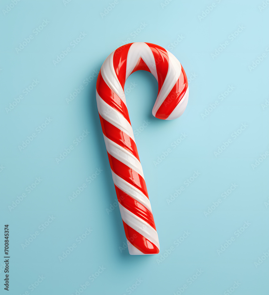 christmas candy cane isolated on a blue background