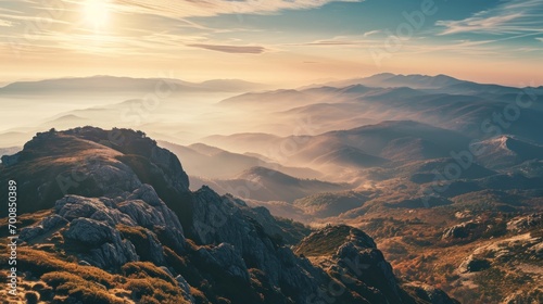 A panoramic view of a majestic mountain range at sunrise