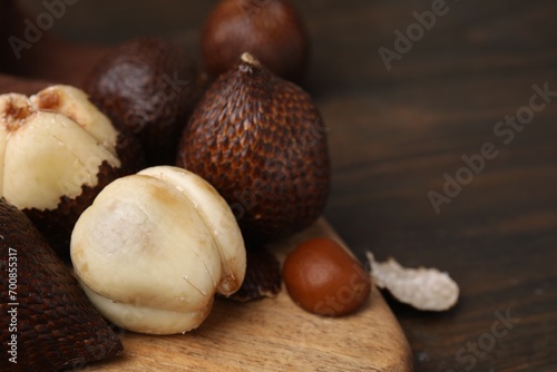 Fresh salak fruits on wooden table, closeup. Space for text