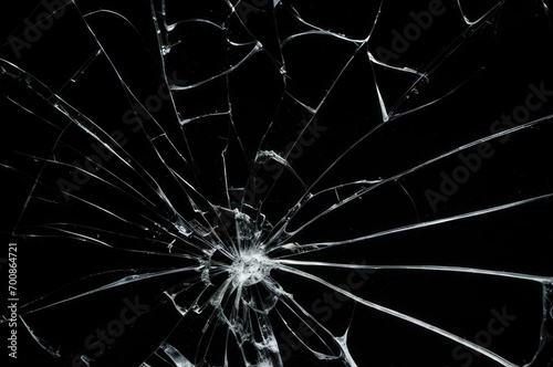 Broken glass on a black background, cracks, shards.