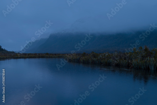 Photograph of a mountain range behind Mirror Lakes in Fiordland National Park on the South Island of New Zealand