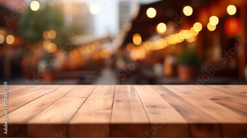 A warm bokeh light effect creates a beautiful blurred background, with a wooden tabletop in the foreground inviting product display.