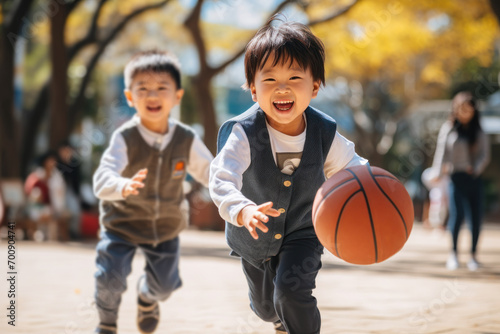 Childhood: Two Young Boys Playing Basketball in the Park  © Distinctive Images