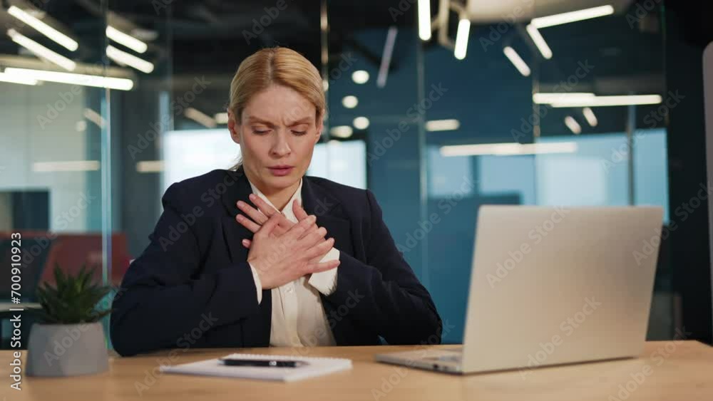 Stressed Businesswoman Experiencing Respiratory Distress and Chest Pain at Workplace. Female Hand on Chest. Concepts of Panic Attack, Heart Attack, Thoracic Osteochondrosis, Asthma, and Wellness.