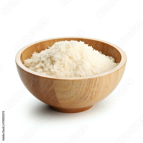 Wooden bowl of boiled rice on white background, close-up