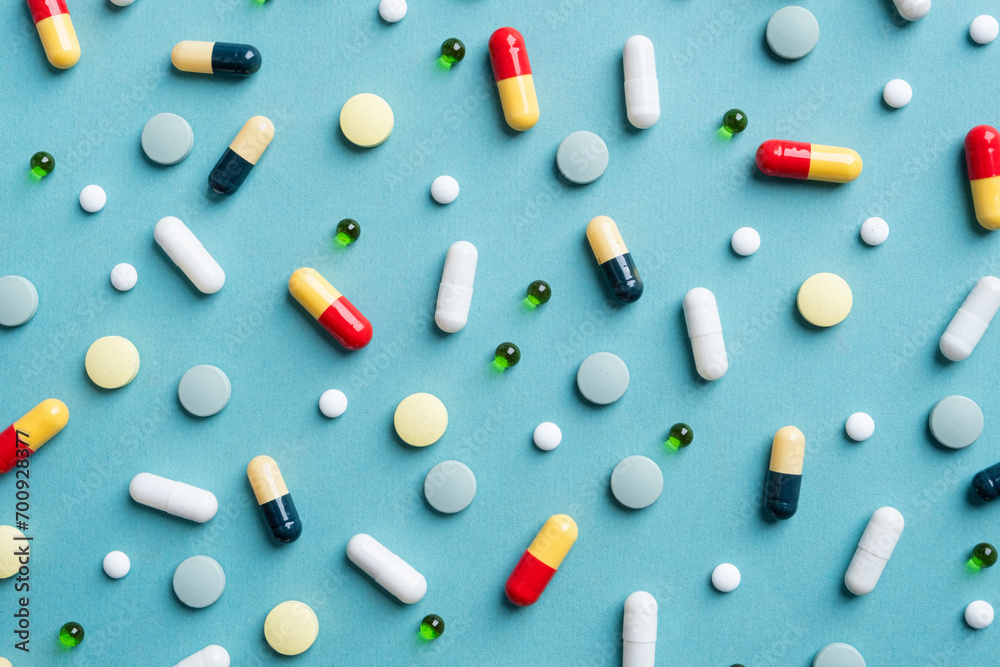 Different pills on color background, flat lay Different pills on color background, flat lay