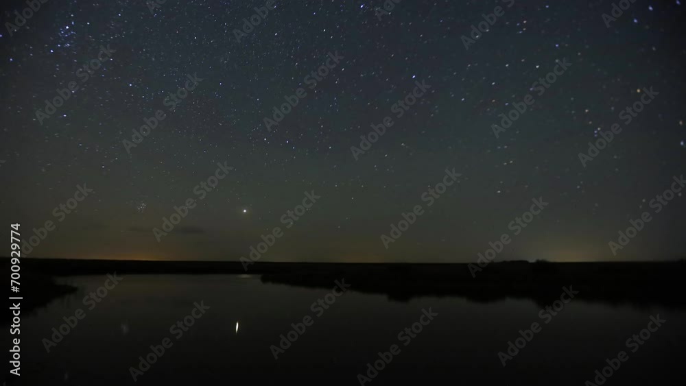 Starry timelapse in the wild above the lake Starry timelapse in the wild above the lake