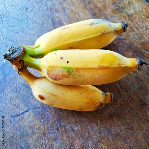 Thai namwa bananas on wooden table 
