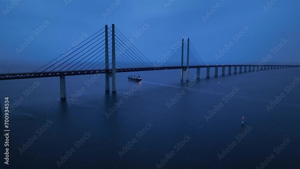 Panoramic Aerial view of Oresund Bridge who is a combined motorway and railway, sea bridge between Denmark and Sweden (Copenhagen and Malmo) and ship - seascape of Baltic Sea, Europe from above Panoramic Aerial view of Oresund Bridge who is a combined motorway and railway, sea bridge between Denmark and Sweden (Copenhagen and Malmo) and ship - seascape of Baltic Sea, Europe from above
