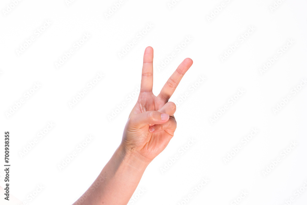Woman showing index and middle fingers on isolated white background Woman showing index and middle fingers on isolated white background