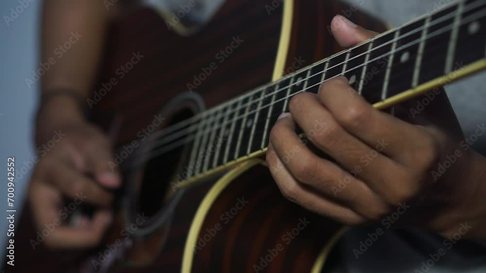 Close-up man playing acoustic guitar Close-up man playing acoustic guitar