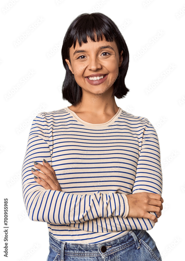 Young Hispanic woman with short black hair in studio who feels confident, crossing arms with determination. Young Hispanic woman with short black hair in studio who feels confident, crossing arms with determination.