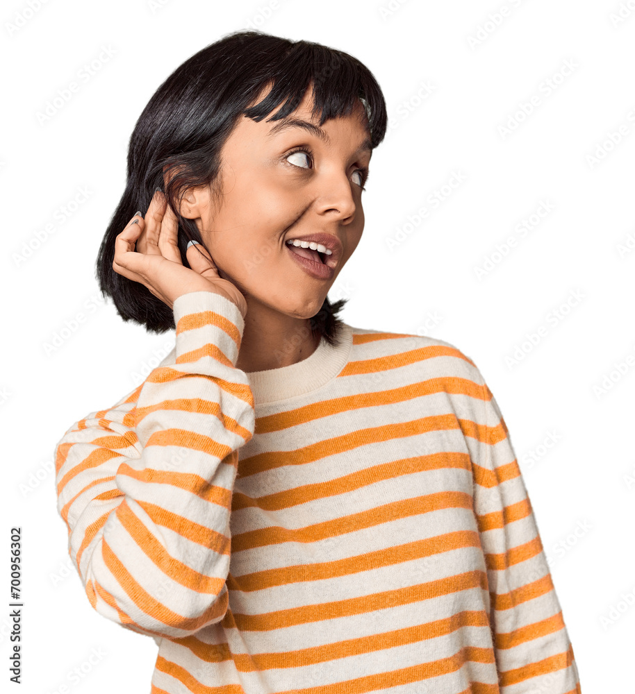 Young Hispanic woman with short black hair in studio trying to listening a gossip. Young Hispanic woman with short black hair in studio trying to listening a gossip.