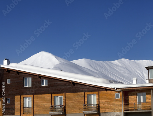 Hotel in snow at winter mountains