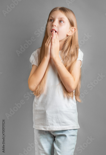 Portrait of a surprised little girl