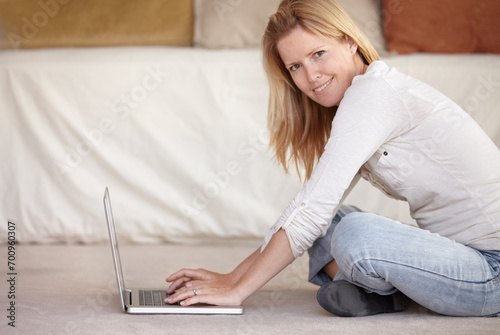 Woman  work from home and laptop on floor  portrait and type email for job  copywriter and creative. Freelancer  technology and working for startup publishing company  internet and remote worker