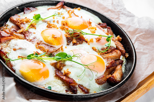 Fried eggs on a frying pan