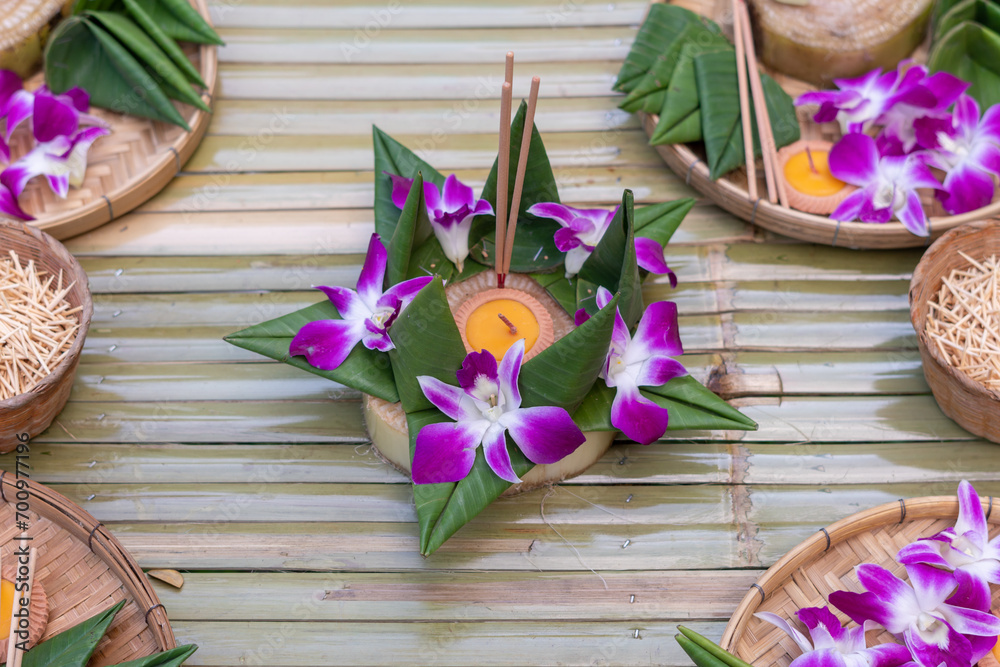 Krathong, the handcrafted floating candle made of floating part decorated with green leaves colorful flowers and many sorts of creative materials for festival Loy Krathong in Thailand Krathong, the handcrafted floating candle made of floating part decorated with green leaves colorful flowers and many sorts of creative materials for festival Loy Krathong in Thailand