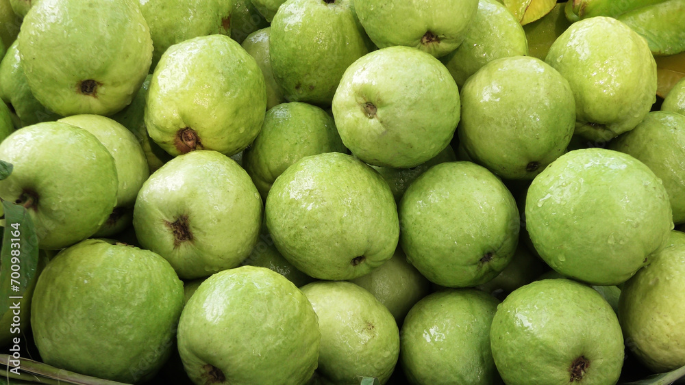 Stacked guava fruits displayed for sale Stacked guava fruits displayed for sale