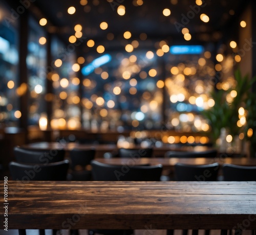 Empty wooden table and Coffee shop blur the background with a bokeh image.