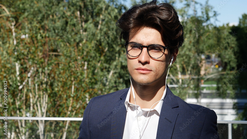 Stylish Young Business Man with Earphones Stylish Young Business Man with Earphones