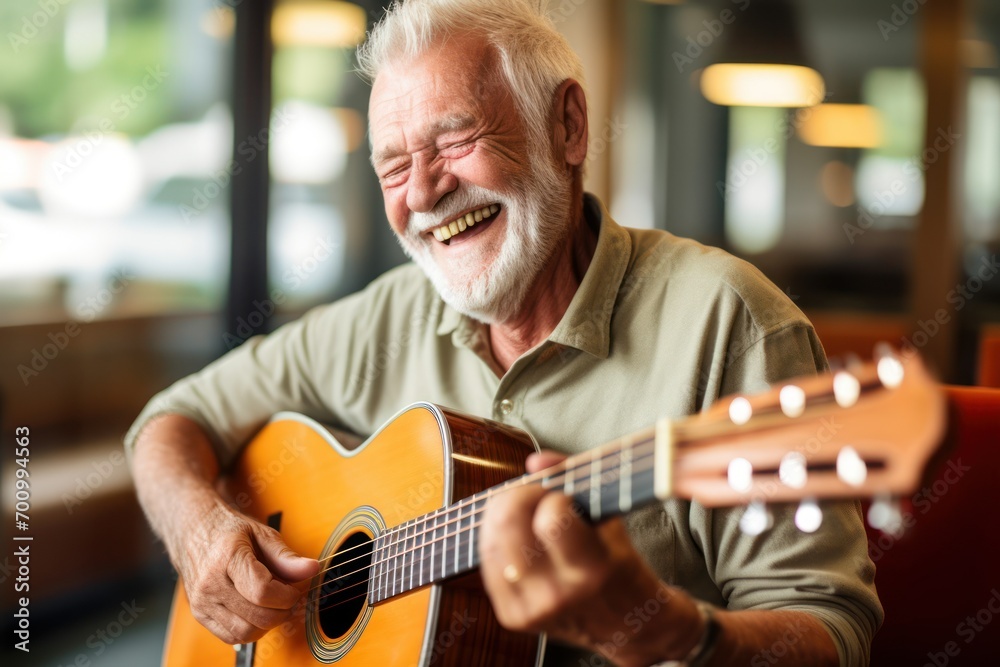 Fototapeta premium An smilling older person play a guitar