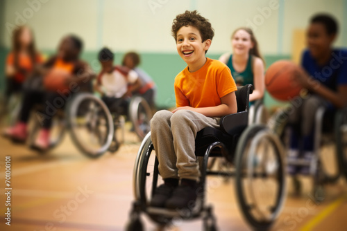 Cheerful Young Boy in Wheelchair Playing Basketball. photo