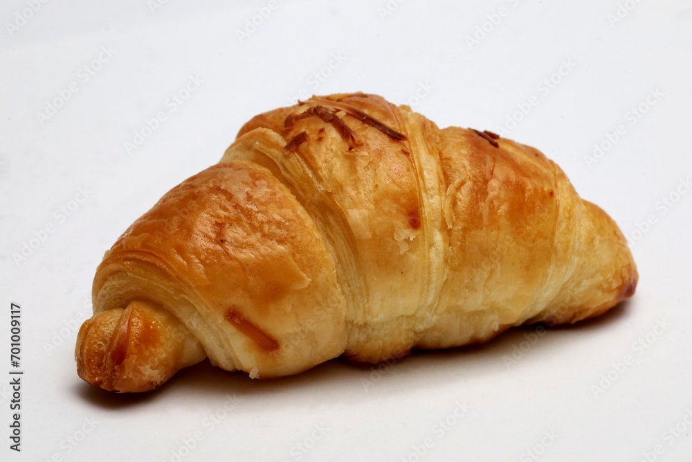 croissant closeup, isolated on white background. croissant closeup, isolated on white background.