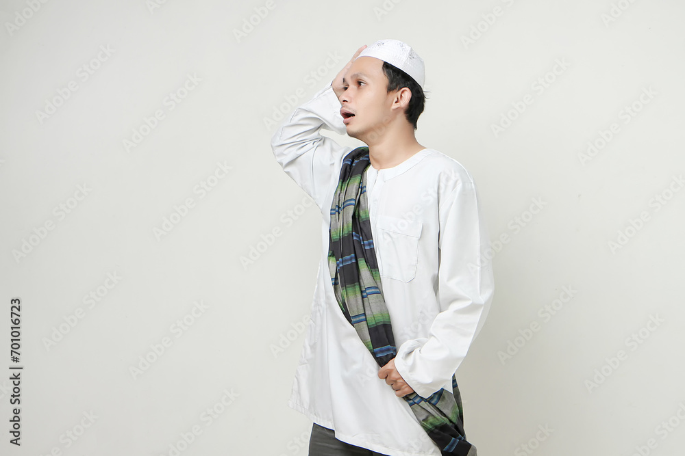 asian muslim man with confused shock expression. People religious Islam lifestyle concept. celebration Ramadan and ied Mubarak. on isolated background. asian muslim man with confused shock expression. People religious Islam lifestyle concept. celebration Ramadan and ied Mubarak. on isolated background.